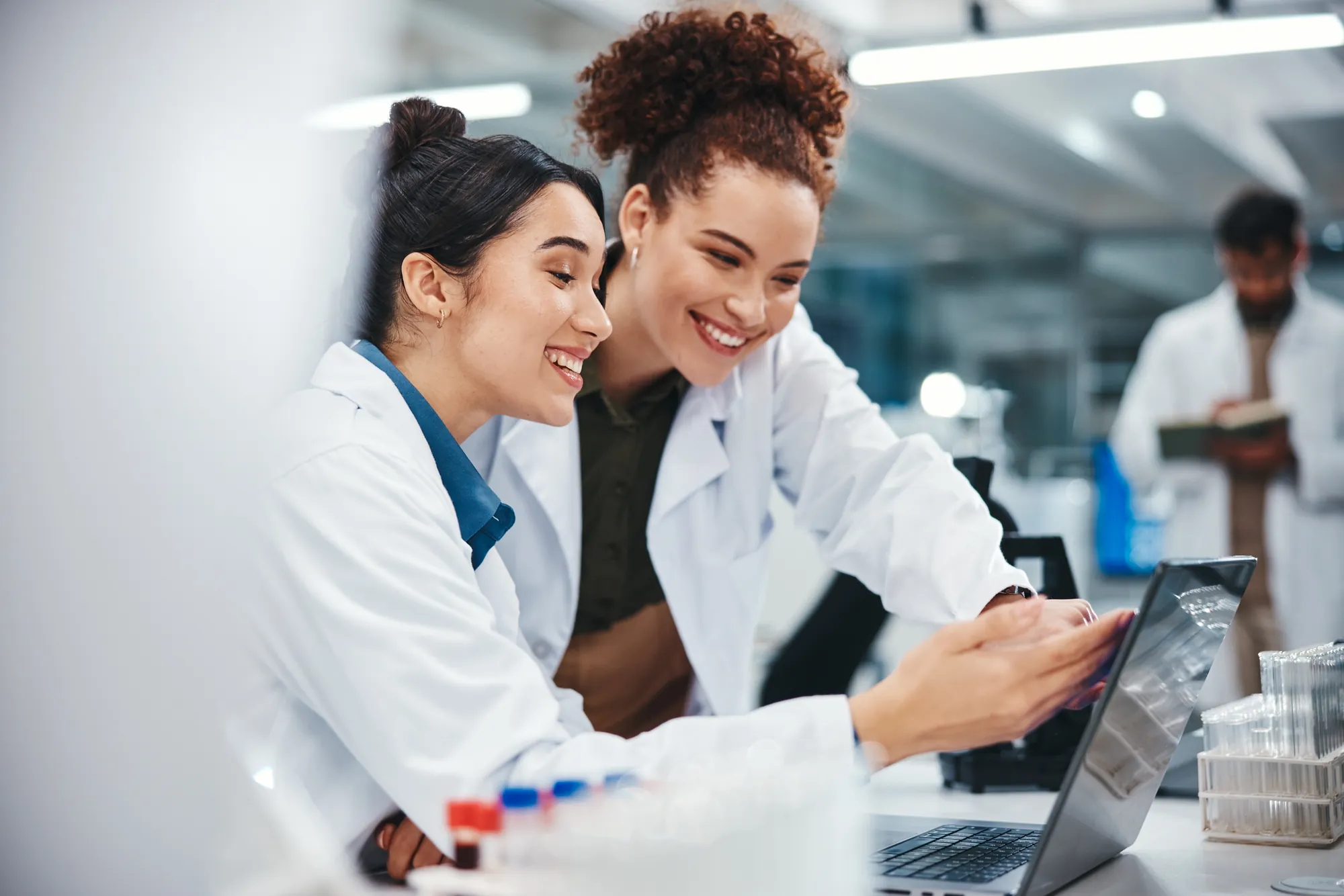 Scientists reviewing chromatography results on a laptop