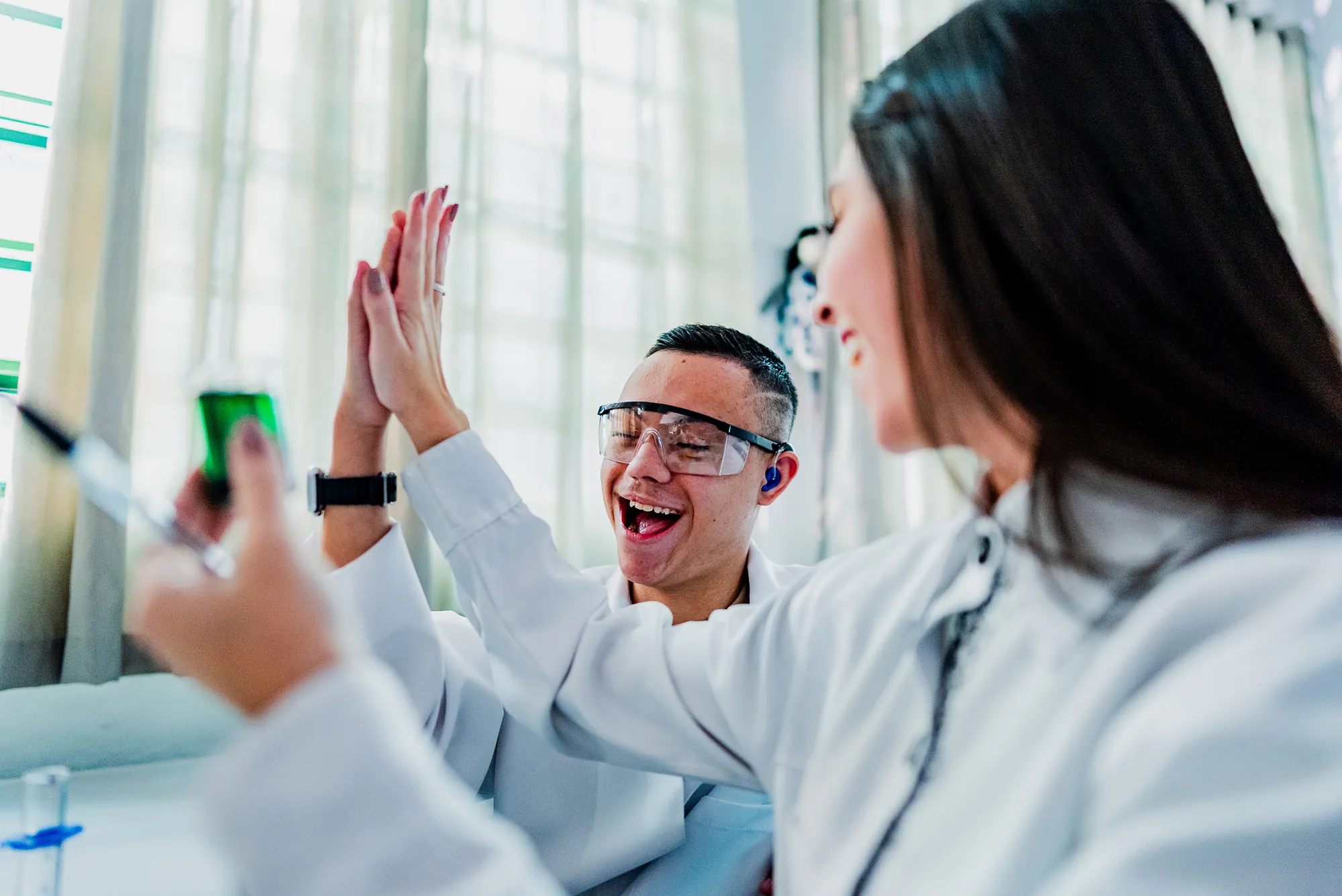 Scientists celebrating results in a laboratory