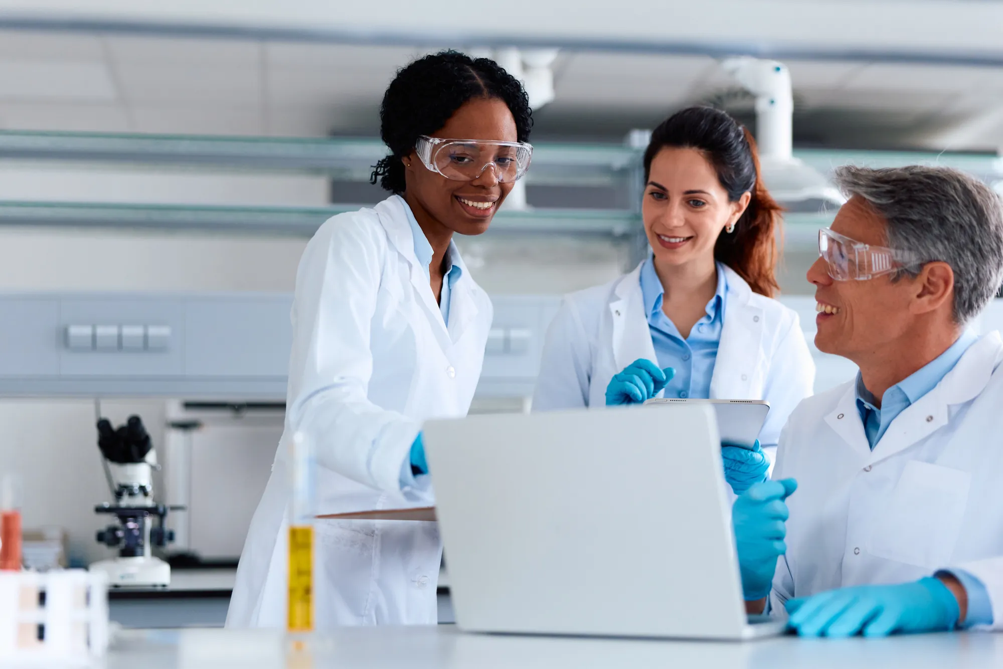 Laboratory team reviewing results on a laptop