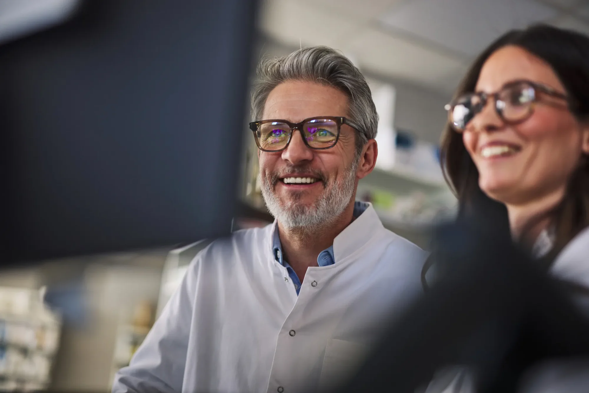 Scientists reviewing chromatography results on screen